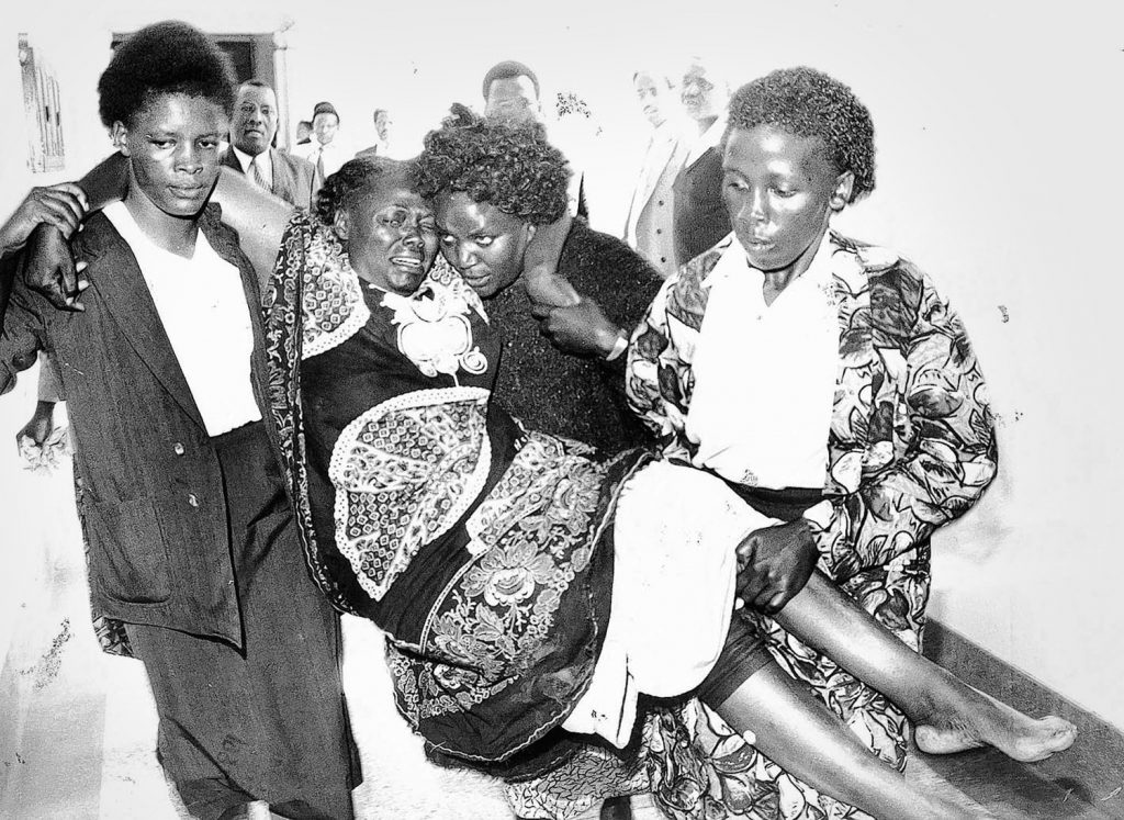 Picture dated January 1999 shows 2004 Nobel Peace Prize winner Wangari Maathai, environmentalist and human rights campaigner, carried to the courts after she was beaten by a mob after she confronted private developers that had illegally taken land in the Karura forest.